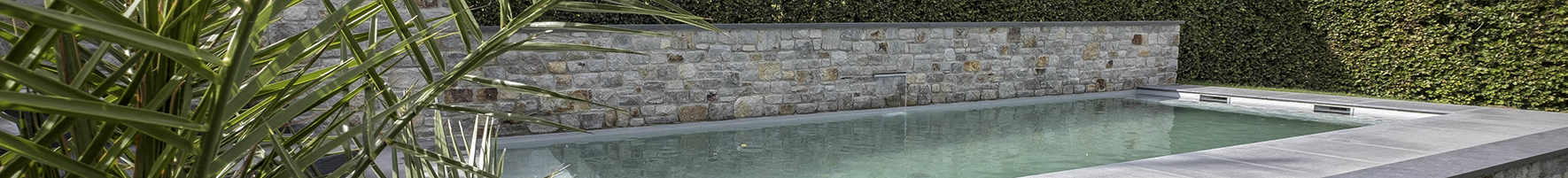 A swimming pool with emerald-green hues